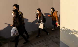 People wear masks to prevent spread of Covid-19, in Hong Kong epa08223554 Pedestrians wear face masks in Hong Kong, China, 17 February 2020. As of 17 February, the number of those infected by the coronavirus that causes the disease known as Covid-19, also known as coronavirus, grew to 59 in Hong Kong. More than 70,000 people have been infected in mainland China with the death toll at 1,770. EPA/JEROME FAVRE