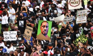 March On Washington To Protest Police Brutality epa08632581 People gather and hold up signs at the Lincoln Memorial as they listen to the Rev. Al Sharpton speak at the Lincoln Memorial during the 'Commitment March: Get Your Knee Off Our Necks' in Washington, DC, USA 28 August 2020. The March on Washington comes on the 57th anniversary of Dr. Martin Luther King's historic march, when he delivered his 'I Have a Dream' speech. EPA/MICHAEL M. SANTIAGO / POOL