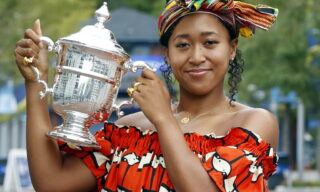 2020 US Open Tennis Championships epa08666559 Naomi Osaka of Japan poses with the Championship Trophy on the grounds of the US Open Tennis Championships at the USTA National Tennis Center in Flushing Meadows, New York, USA, 13 September 2020. Due to the coronavirus pandemic, the US Open is being played without fans and runs from 31 August through 13 September. EPA/JASON SZENES