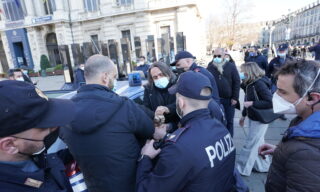 No-masks and Covid-19 negationists manifestation in Turin People rejecting the usage of masks and negating Covid-19 protest in Castello square, in Turin, Italy, 20 March 2021. Protests within the scope of 'World Wide Rally for Freedom and Democracy' anti-vaccine anti-coronavirus restrictions rallies are taking place around the world on 20 March 2021. ANSA/TINO ROMANO