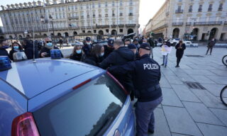 No-masks and Covid-19 negationists manifestation in Turin People rejecting the usage of masks and negating Covid-19 protest in Castello square, in Turin, Italy, 20 March 2021. Protests within the scope of 'World Wide Rally for Freedom and Democracy' anti-vaccine anti-coronavirus restrictions rallies are taking place around the world on 20 March 2021. ANSA/TINO ROMANO