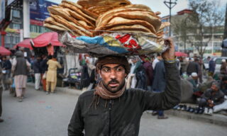 Ramadan preparations in Kabul epa09131372 An Afghan boy sells bread in downtown Kabul, ahead of the holy month of Ramadan during coronavirus pandemic in Kabul, Afghanistan, 12 April 2021. Muslims around the world celebrate the holy month of Ramadan by praying during the night time and abstaining from eating, drinking, and sexual acts during the period between sunrise and sunset. Ramadan is the ninth month in the Islamic calendar and it is believed that the revelation of the first verse in Koran was during its last 10 nights. EPA/HEDAYATULLAH AMID